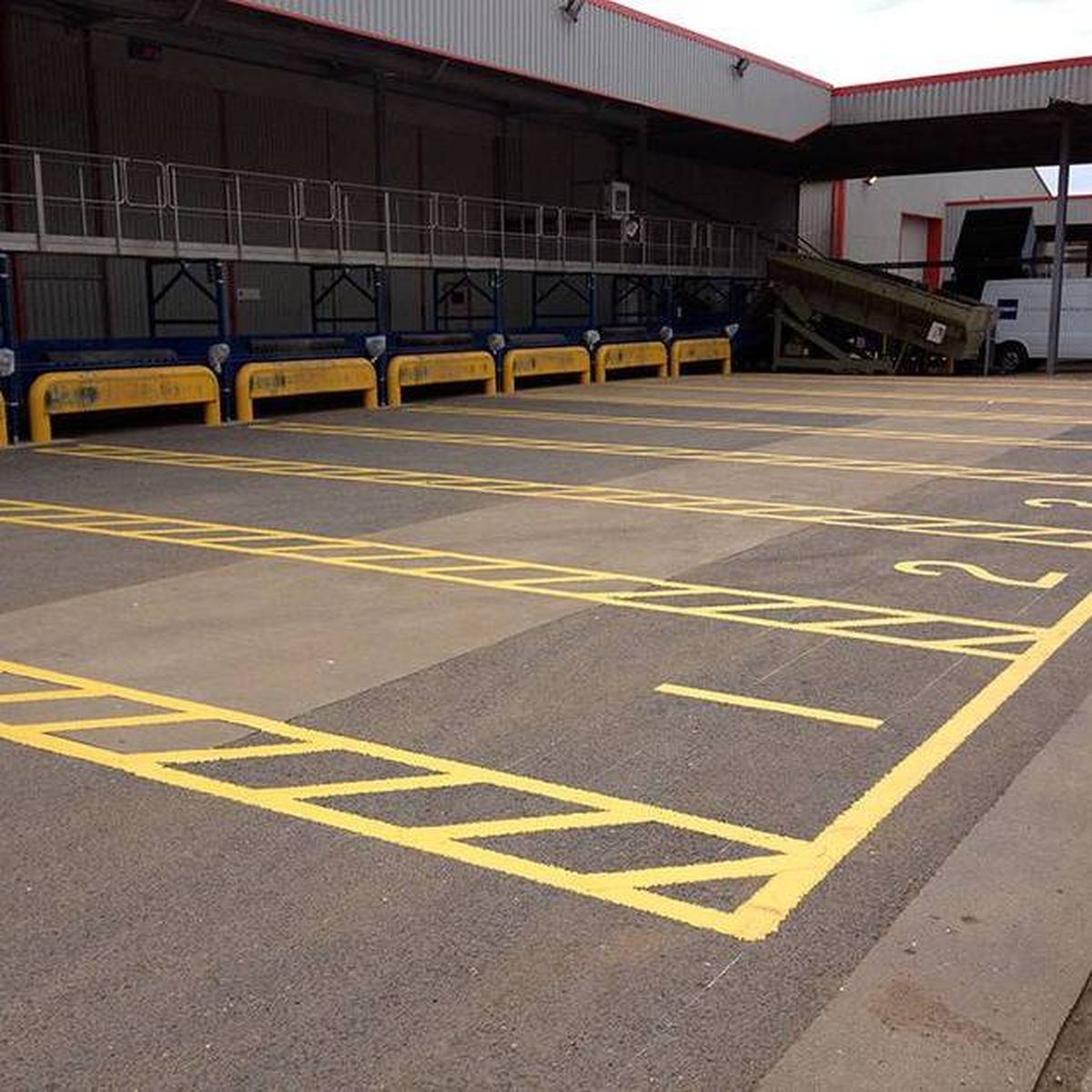 Retail park car park with yellow crosshatch grids and keep-clear markings